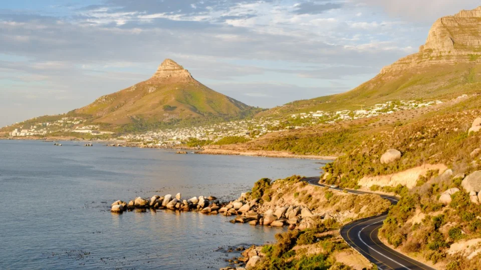 Western Cape coastal road between the ocean and rugged mountains